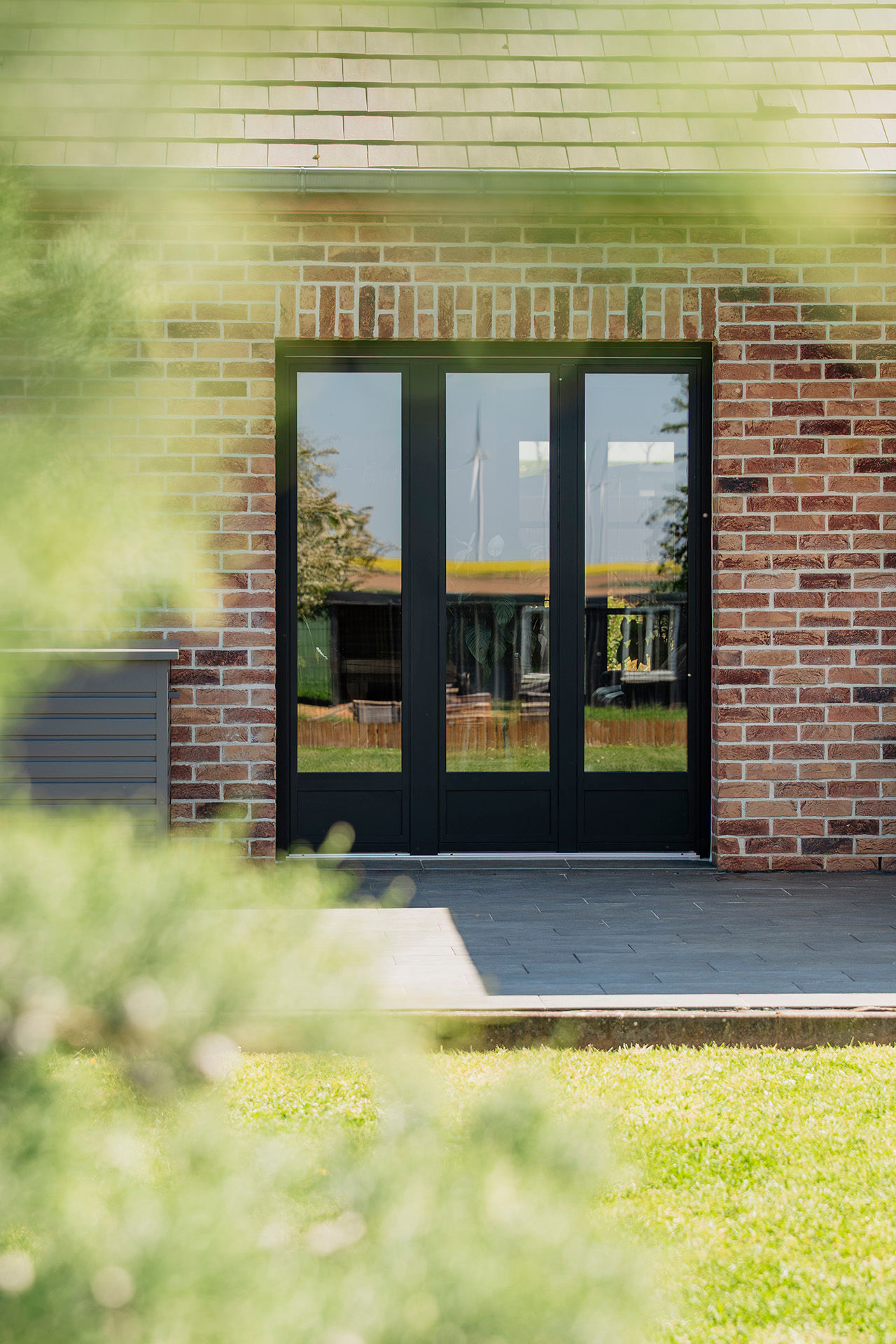 Une ouverture direct et simple vers l'extérieure grâce à la porte-fenêtre en aluminium Pierret